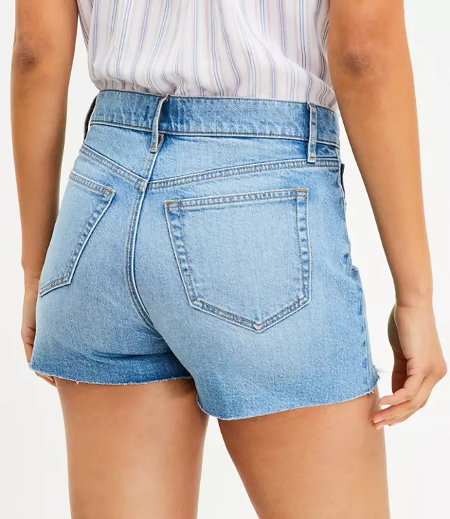 Button Front High Rise Destructed Cut Off Denim Shorts in Mid Indigo Wash