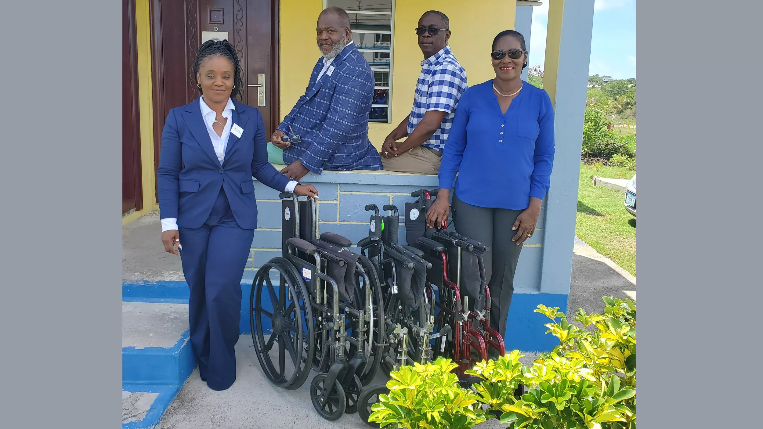 UPP representatives donations of wheelchairs for their