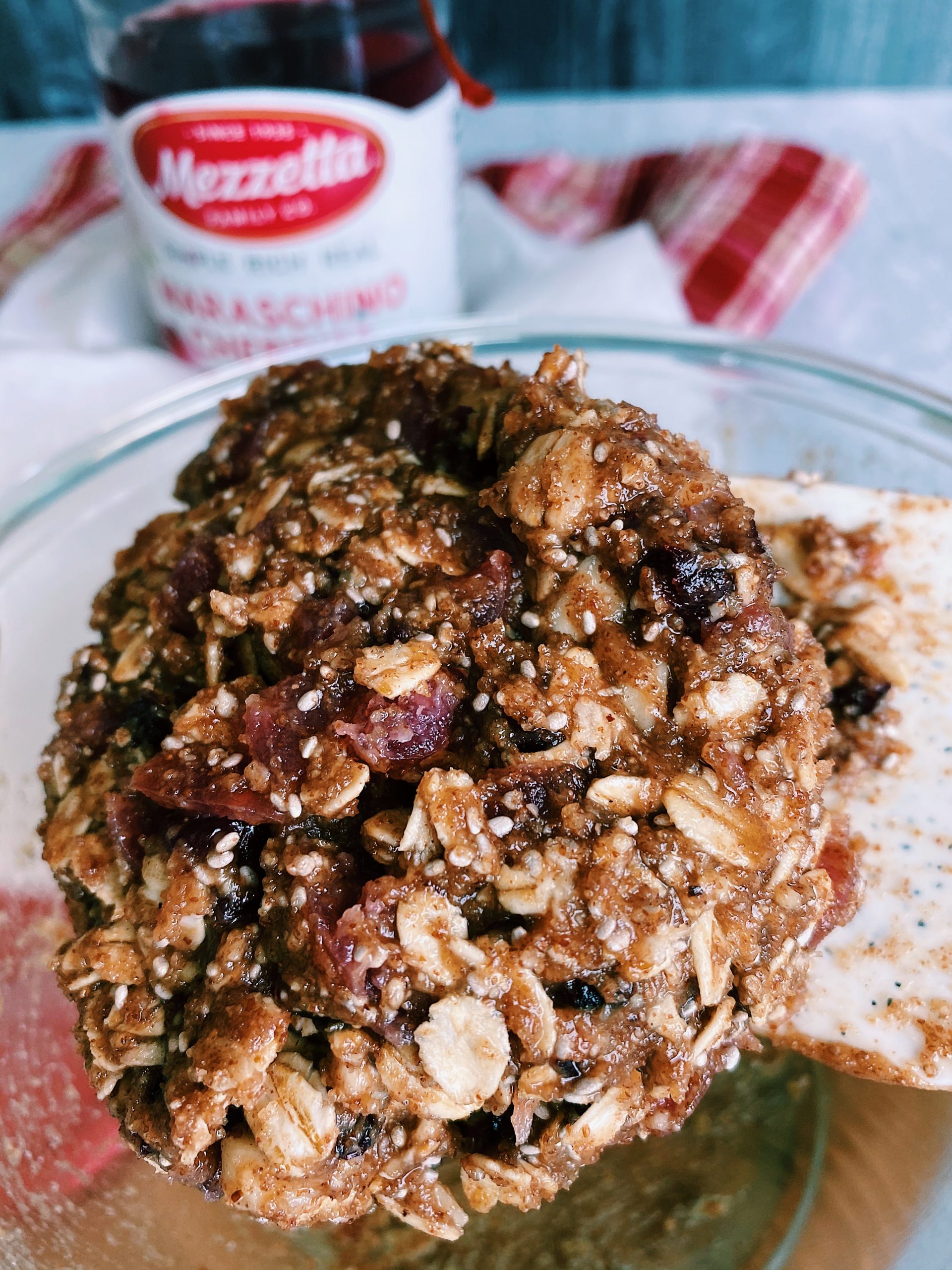 cherry ball dough mixture mixed together in glass mixing bowl.