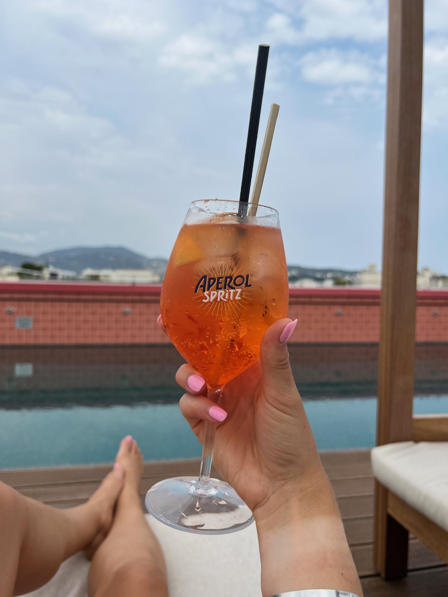 Aperol Spritz overlooking rooftop pool of the AC Marriott in Nice, France.