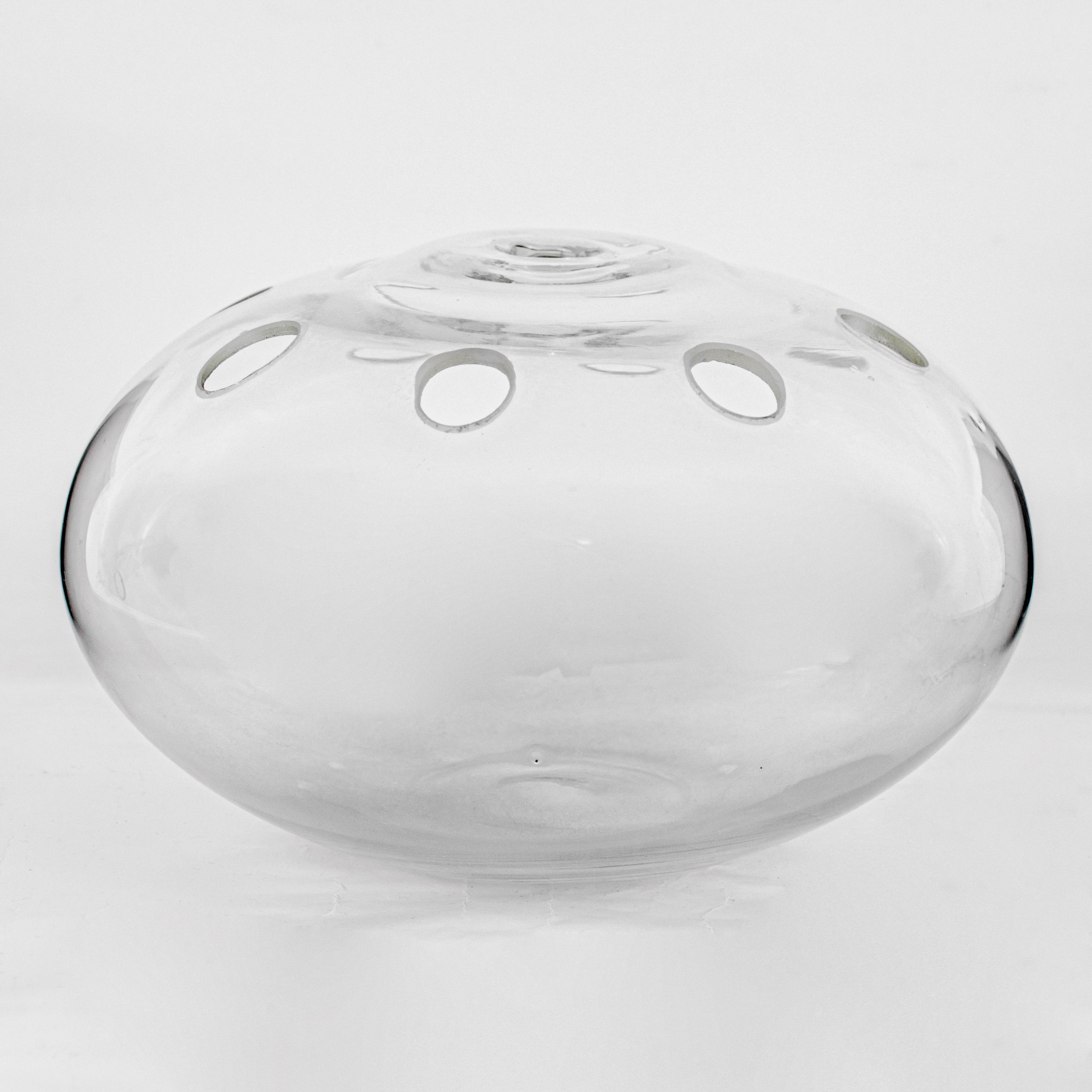  A round glass Ikebana vase