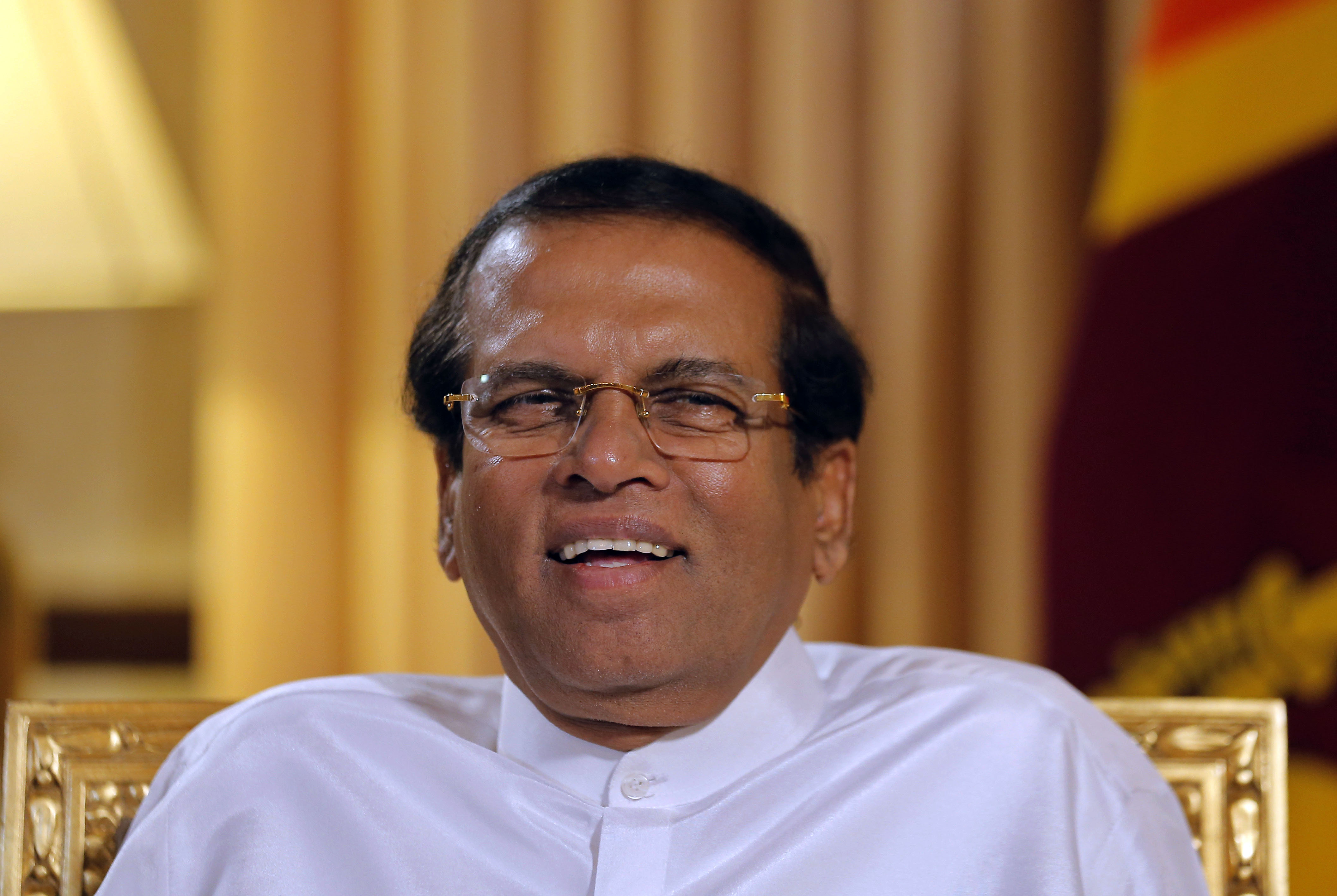 Sri Lankan President Maithripala Sirisena smiles during an interview