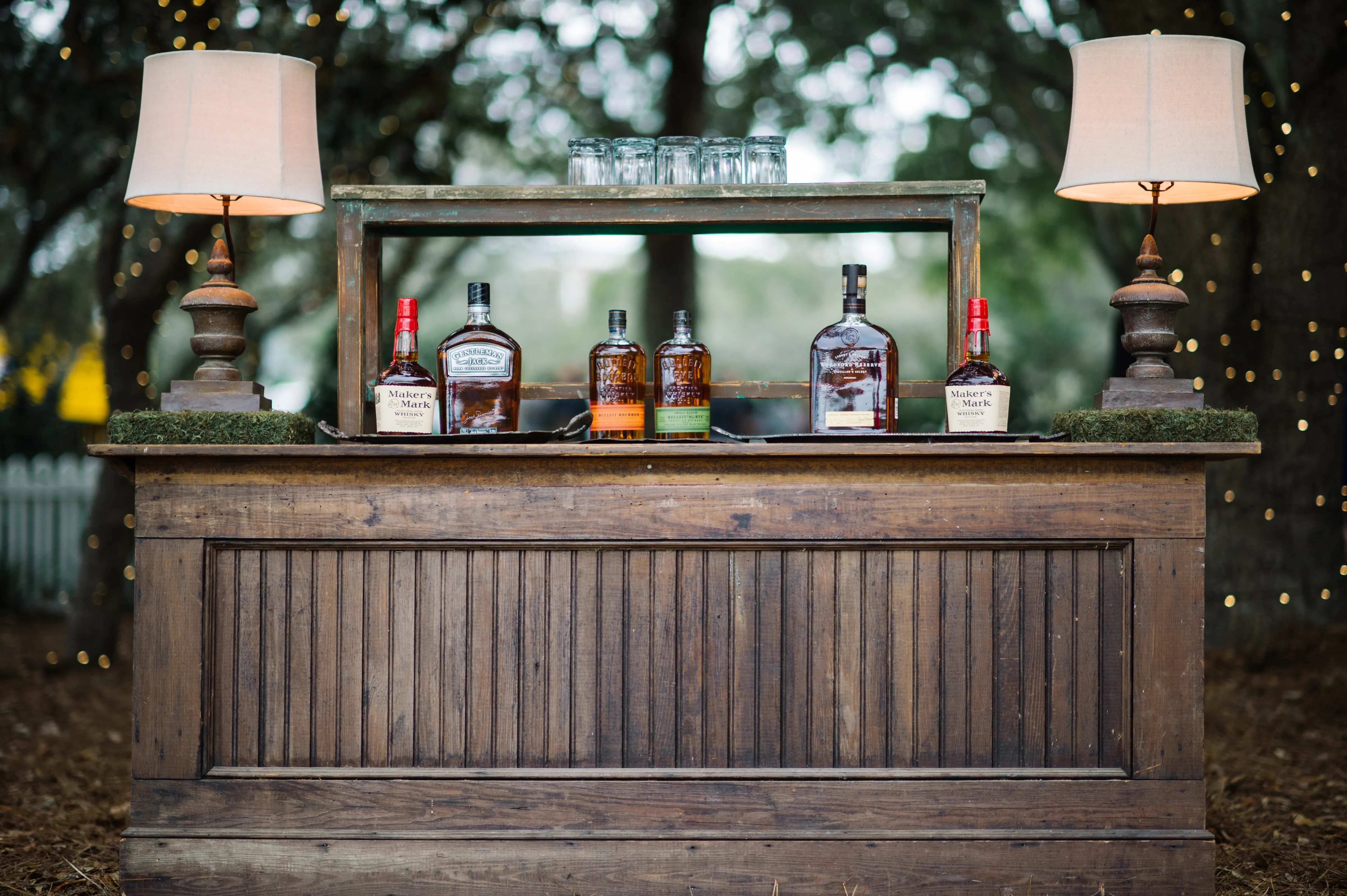 Wooden Whiskey Bar With Moss Accents