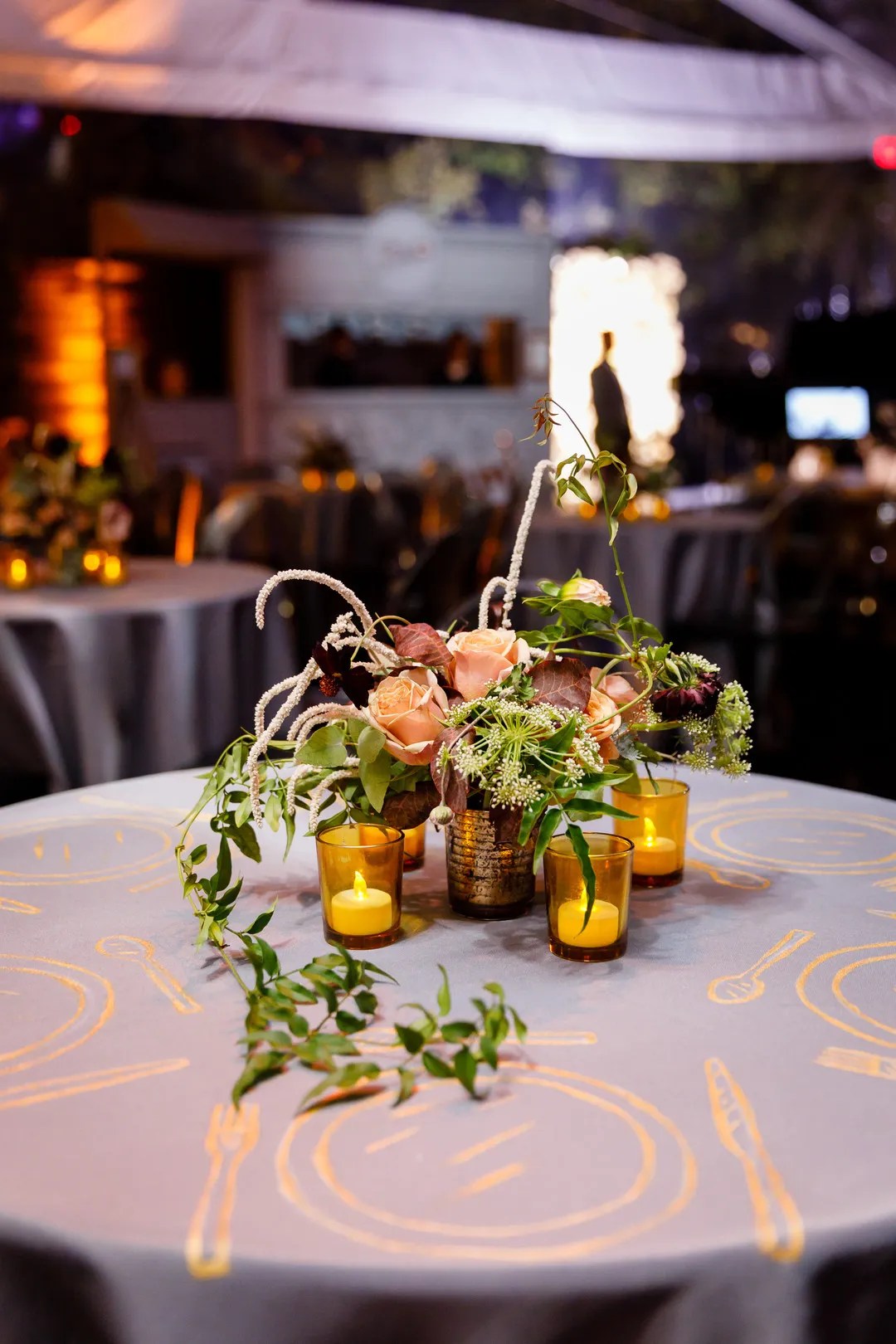 Printed Tablecloth, Candles and Centerpiece with Roses and Greenery