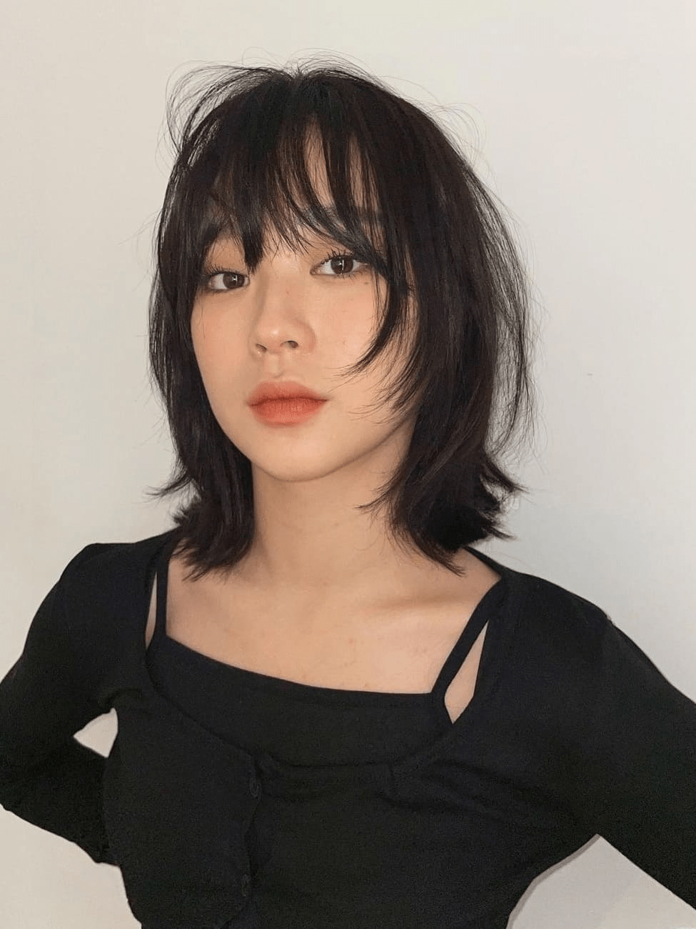 Your Guide to Getting a Hush Cut with Bangs in 2024