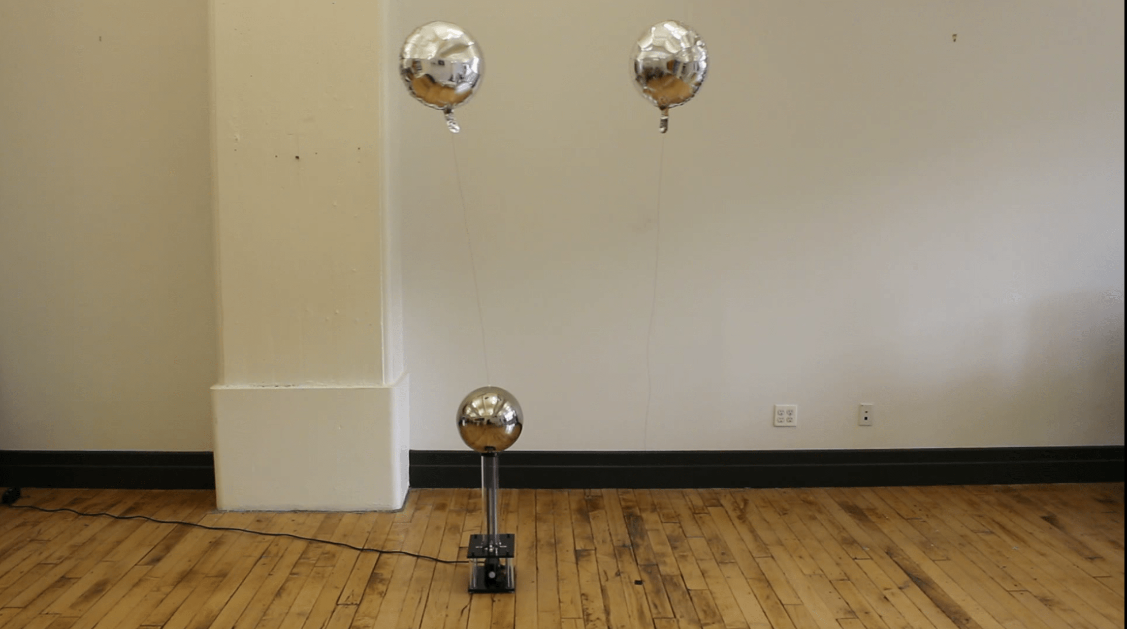 two Mylar balloons: attracted and repelled