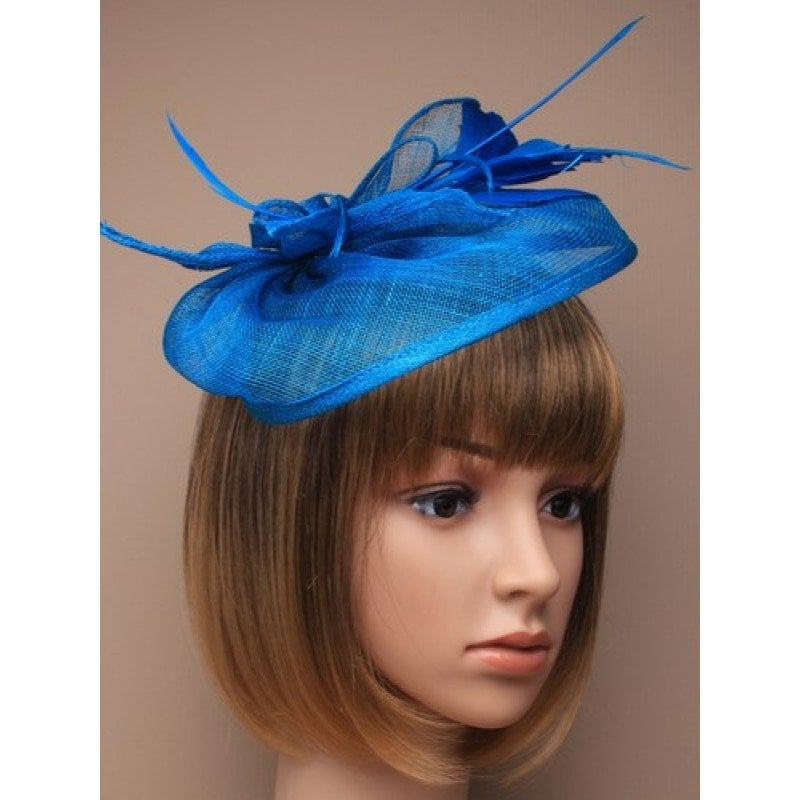 Royal blue fascinator with flower, petals and feathers.