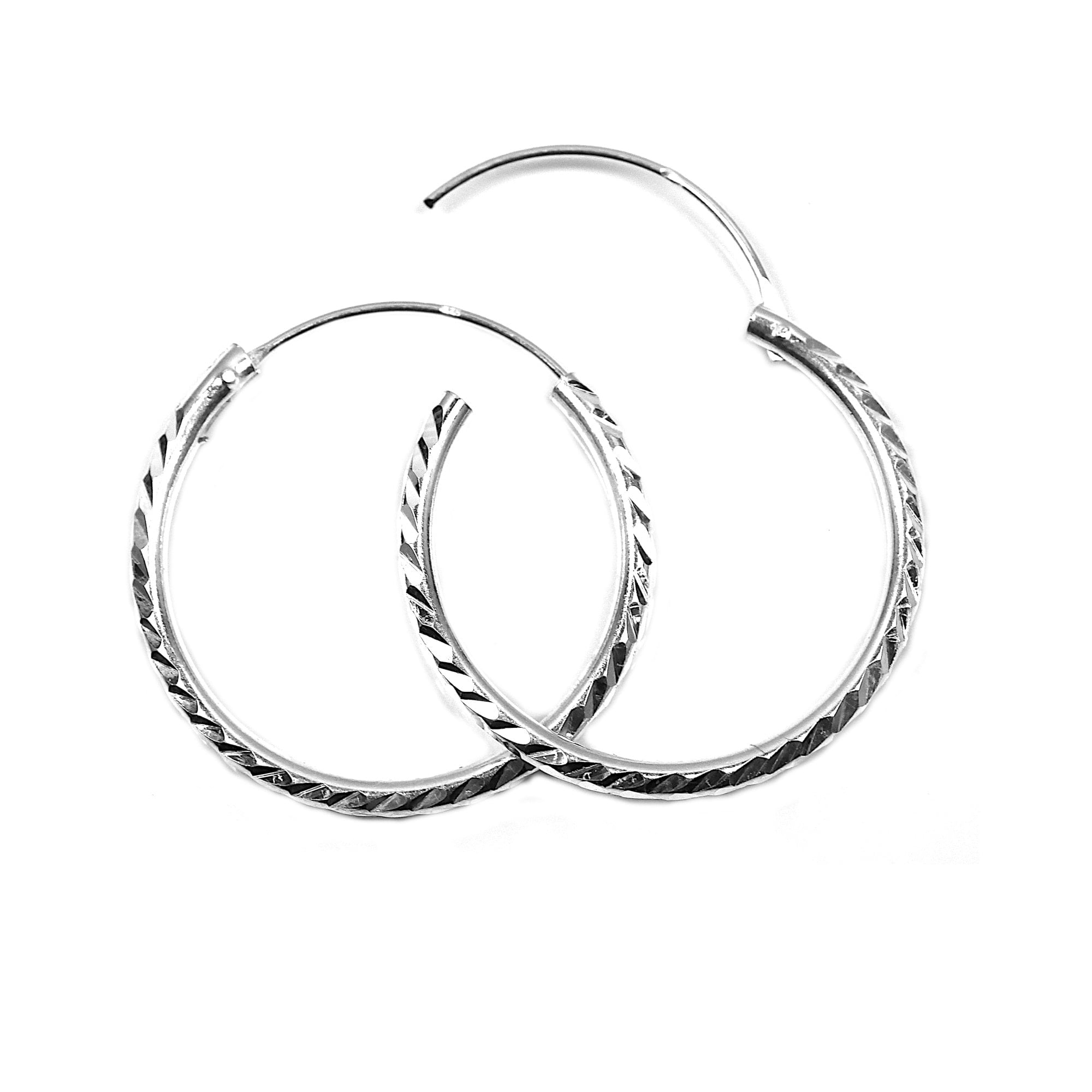 Large (25mm) silver hoop earrings with diamond cut finish