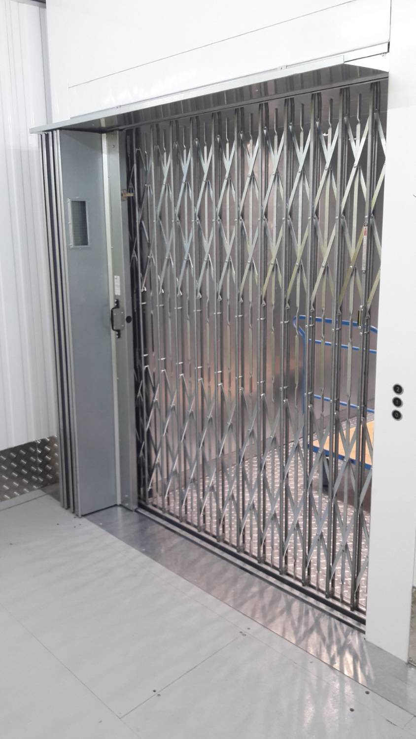 Mid Bar Collapsible Gate Goods lift car door Bolton Gate Company