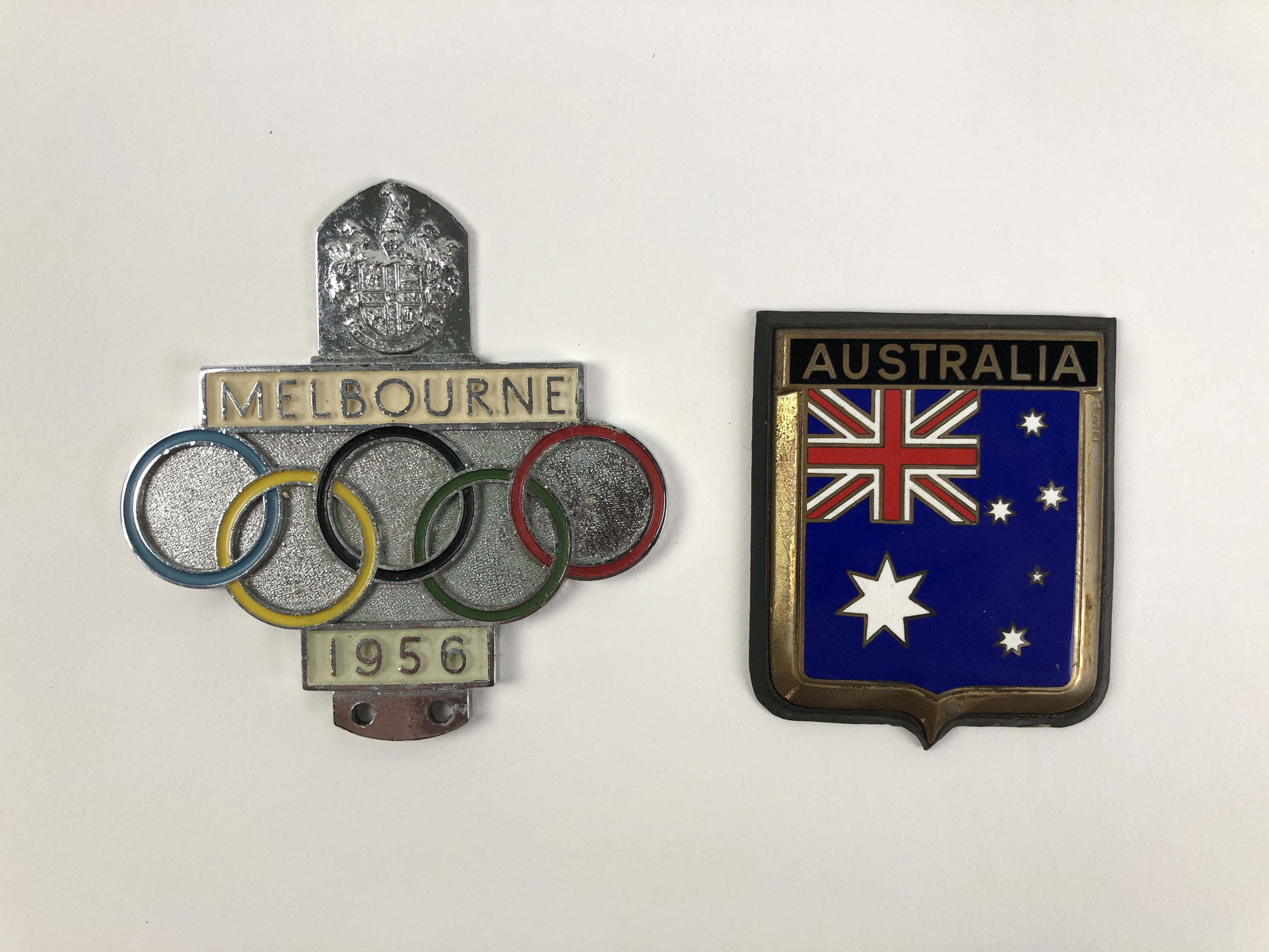 AUSTRALIA Two Australian car badges. 1956 Melbourne Olympics badge