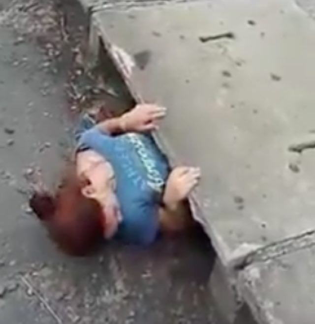 Young Woman Squeezes into a Sewer to Save Trapped Kitten