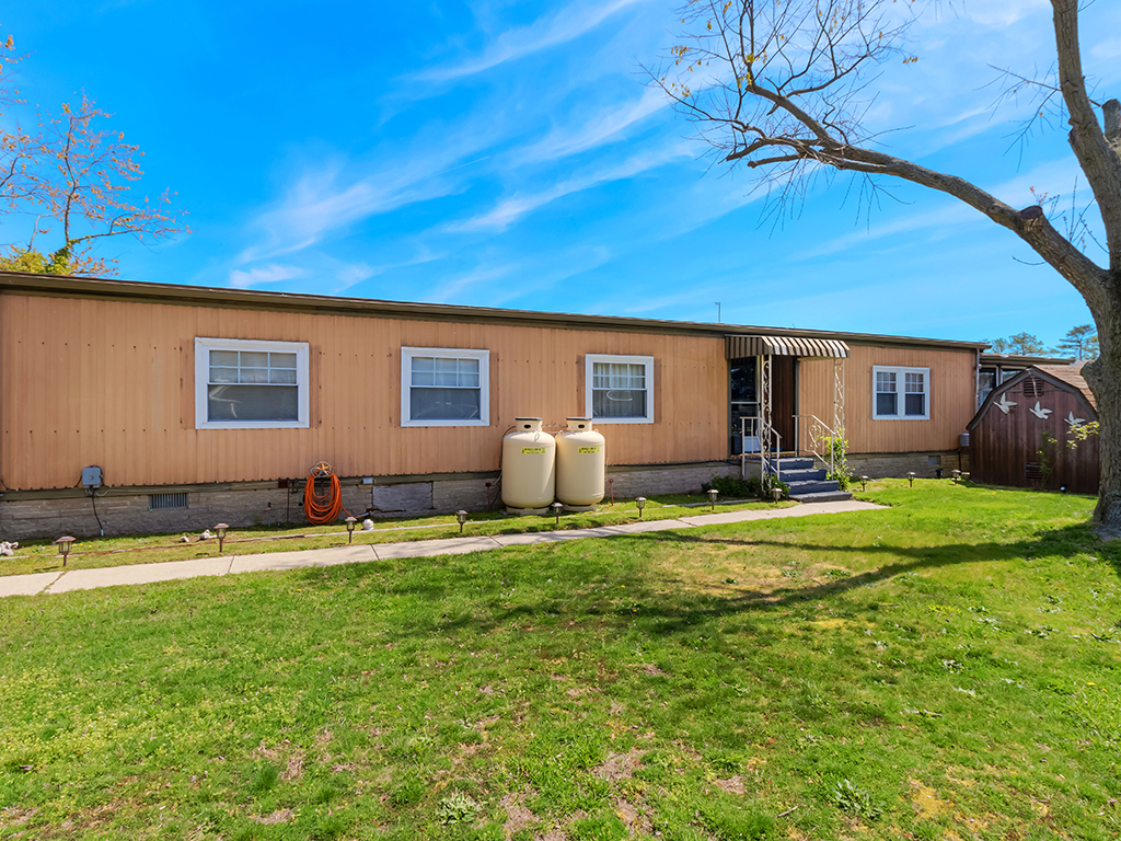Mariners Cove Home Features a Screened Porch Near the Water at the