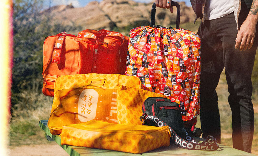 Taco Bell Unveils Travel Collection with CALPAK Inspired by Hot Sauce