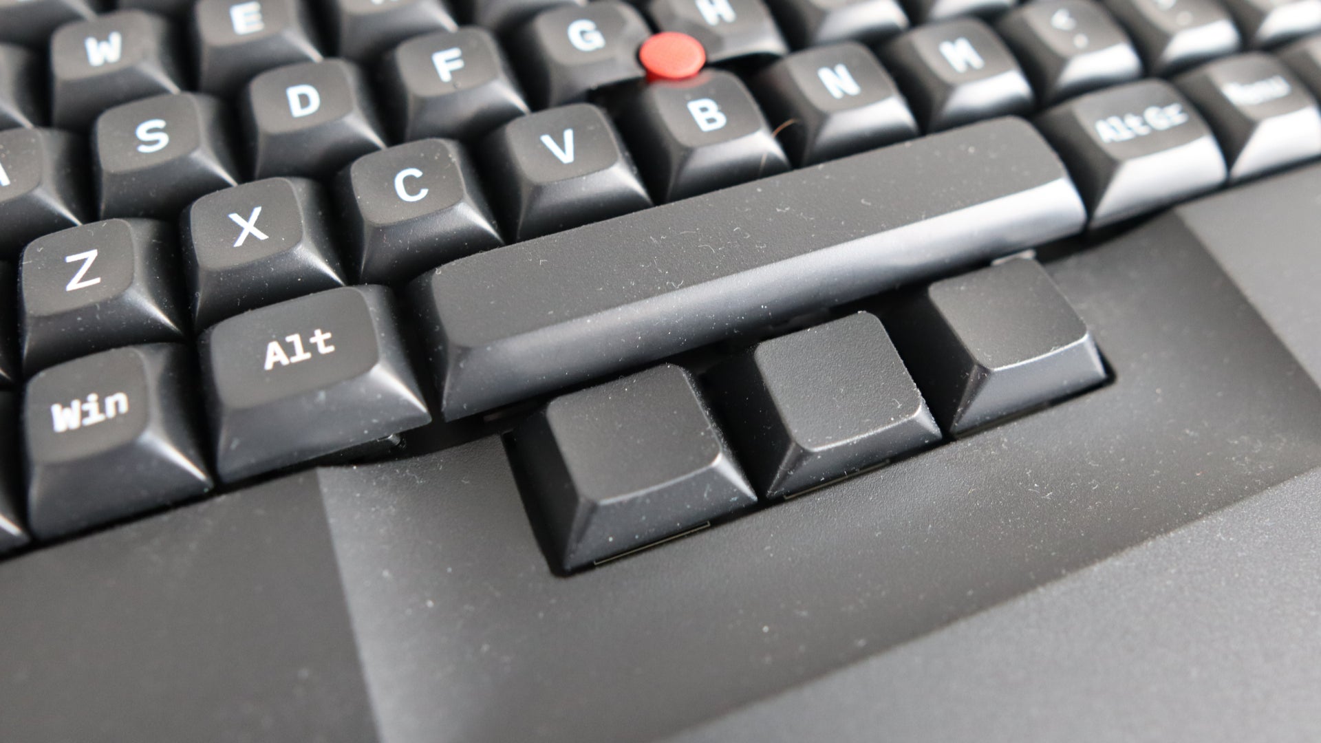 Closeup of mouse buttons on Tex Shinobi keyboard on grey background