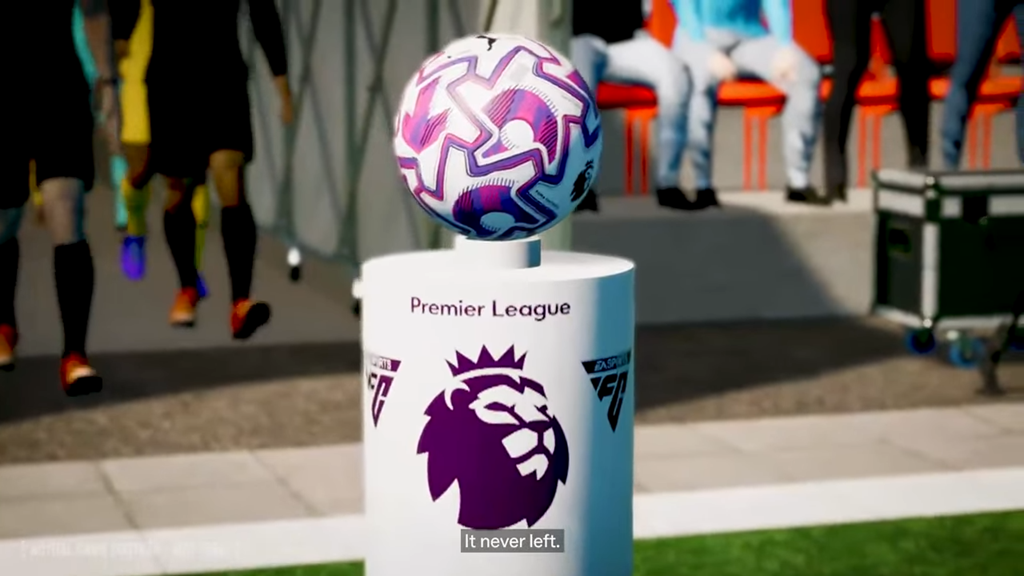 FM26 teaser video screenshot showing the Premier League branded podium holding the ball as players walk out in the new match engine