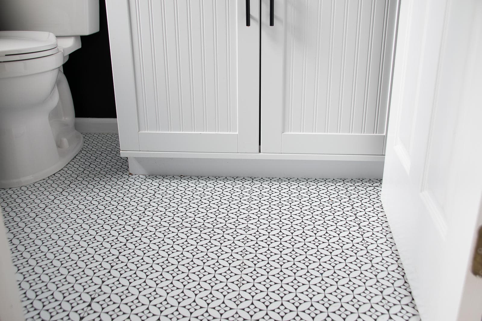 Applying Self Adhesive Vinyl Tiles to our Powder Room Floor At