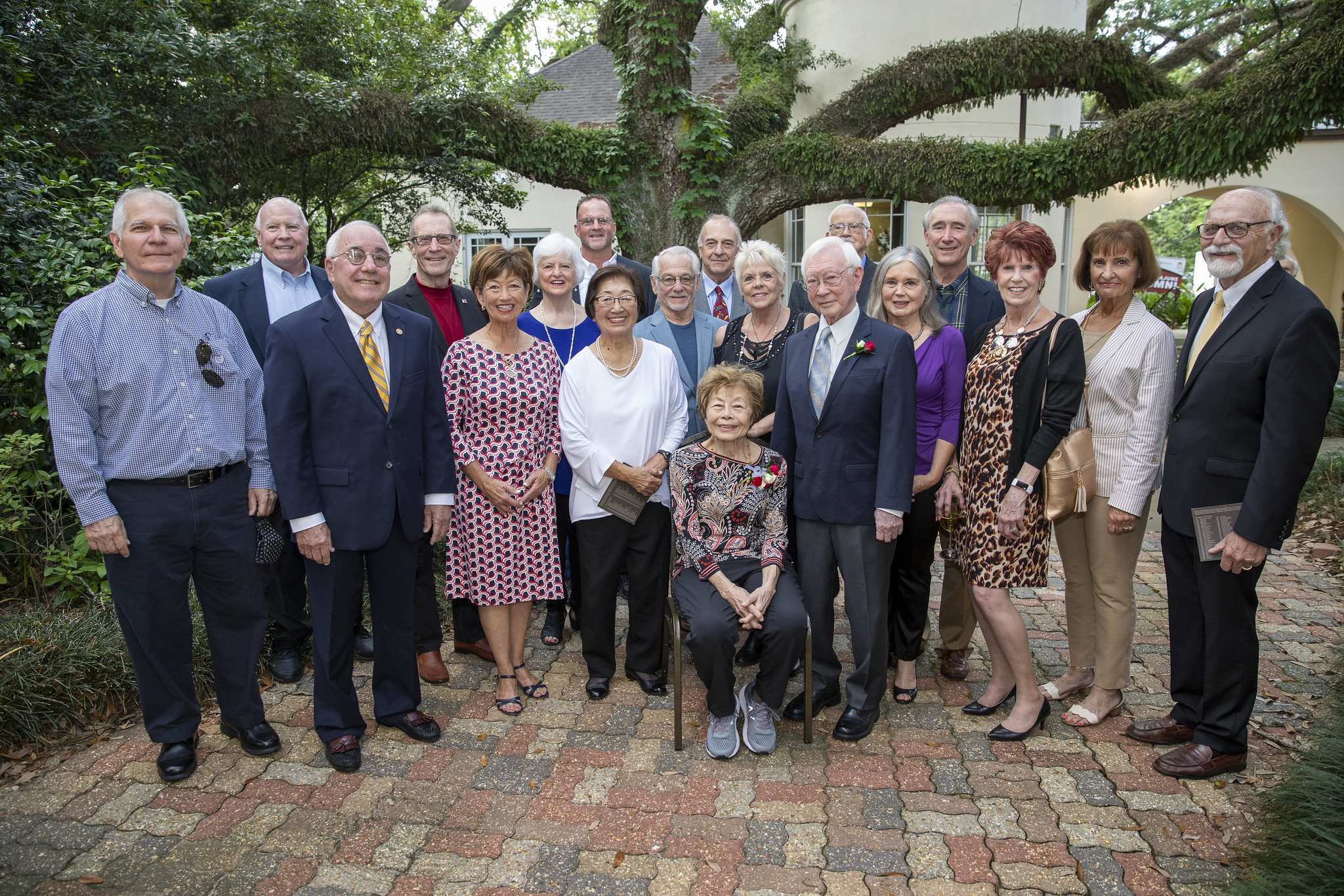 Walter's family and friends pose with him and Sumi.