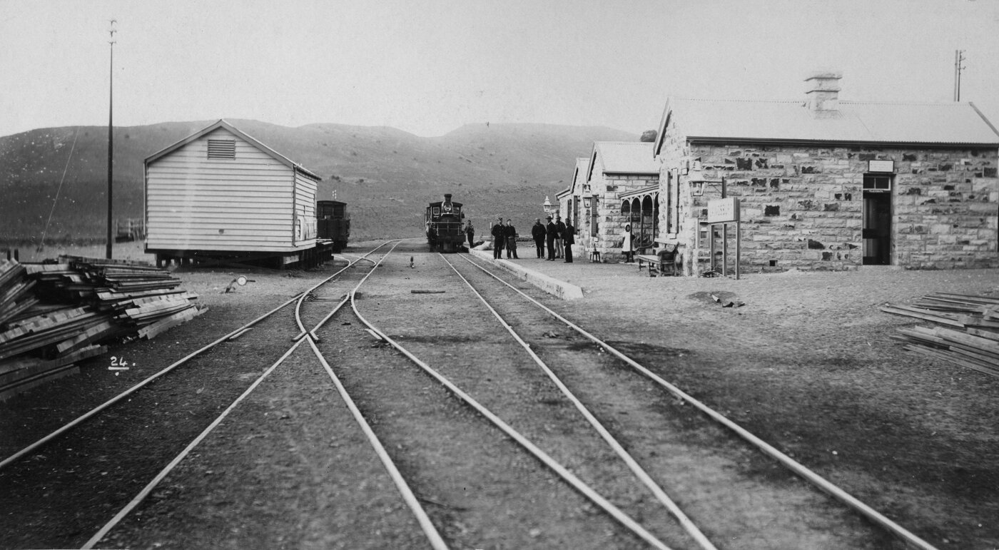Laingsburg, 1895. Station buildings with steam and station