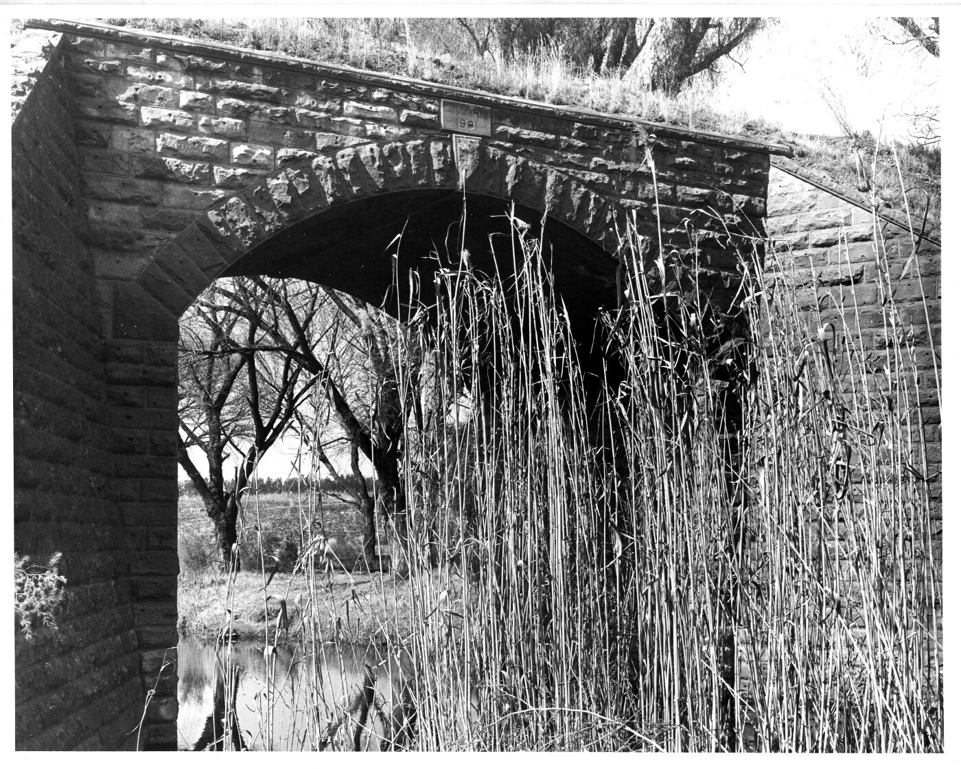 Johannesburg. Small stone bridge at Olifantsfontein with plaque "IMR
