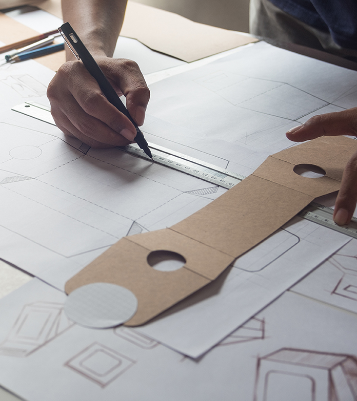 Designer sketching drawing design Brown craft cardboard paper pr > Expense Reduction Analysts