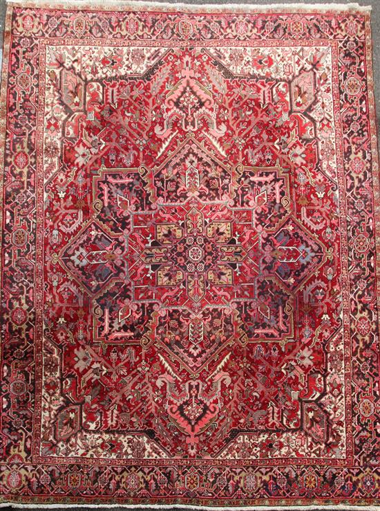 A red ground Heriz carpet, 12ft 8in by 10ft. Sale AUGIN16 Lot 104