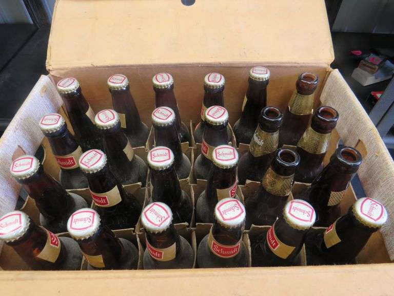 Full case of old Schmidt beer bottles. 19 are unopened. AAA Auction and Realty