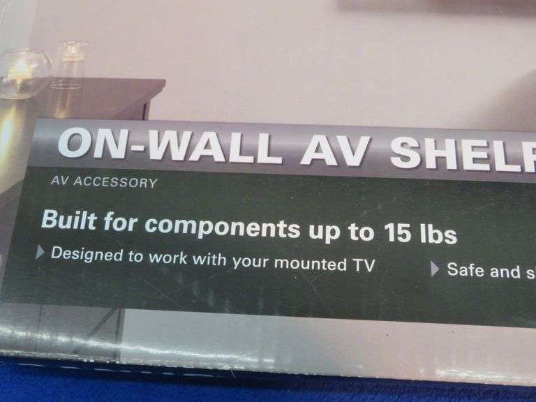 Sanus on wall AV shelf in original packaging AAA Auction and Realty