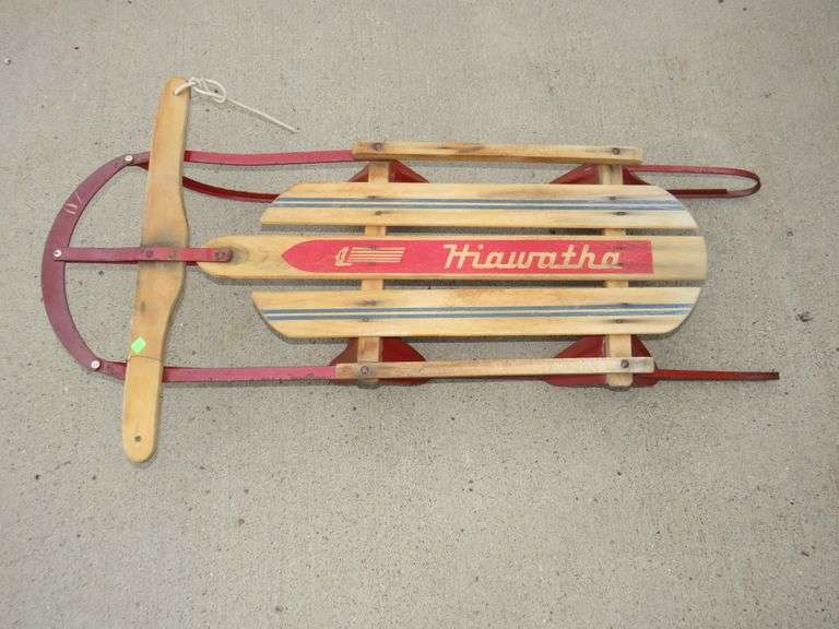 Hiawatha wooden sled with metal runners AAA Auction and Realty