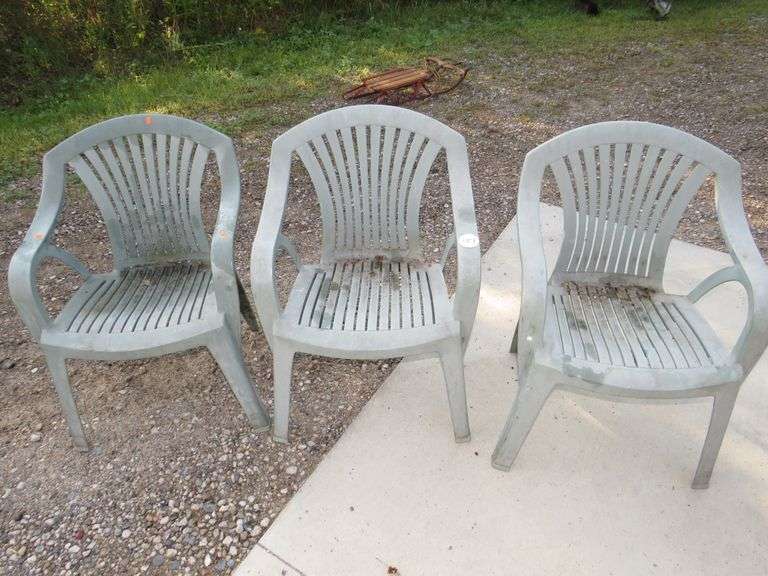 Three plastic patio chairs in good condition AAA Auction and Realty