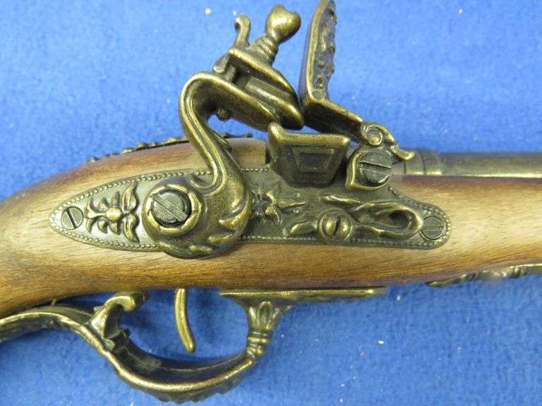 Replica nonfiring black powder pistol. Working hammer and trigger