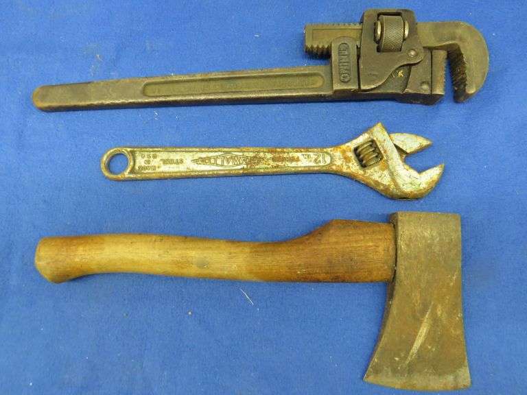 Diamond adjustable wrench, Trimo pipe wrench, and a hatchet AAA
