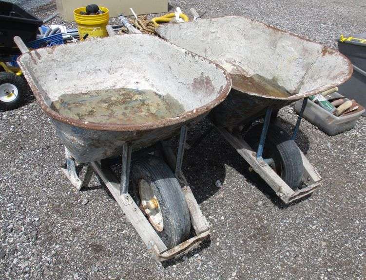 (2) Steel Jackson wheelbarrows, used, heavy wear, one with a cracked