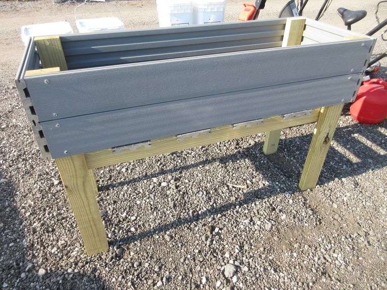 Raised garden bed box, made from 1"Thick Trex deck boards, the legs are
