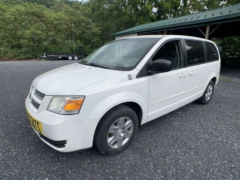 (1) 2010 DODGE GRAND CARAVAN and (1) 2007 FORD 15 PASSENGER VAN located