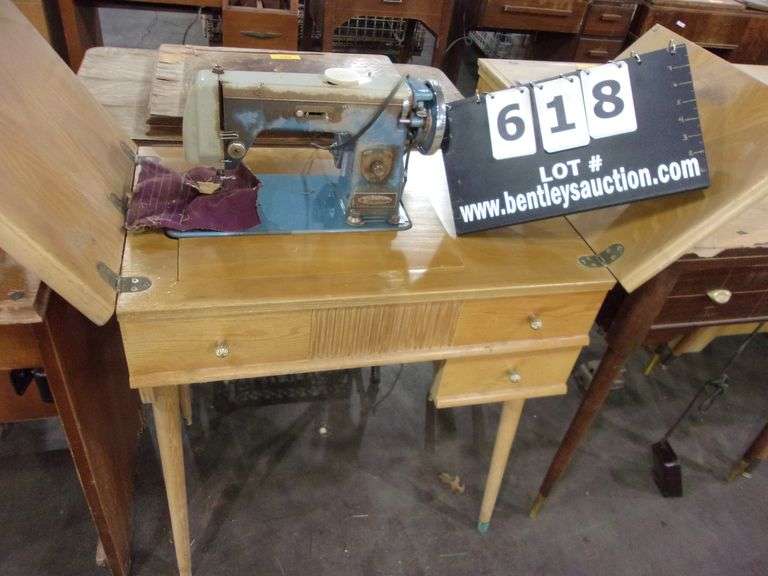 VINTAGE MONTGOMERY WARD SEWING MACHINE IN TABLE Bentley & Associates, LLC