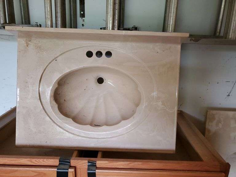 (2) cultured marble bathroom sinks. Clamshell is 22x31 w/ 4" backsplash