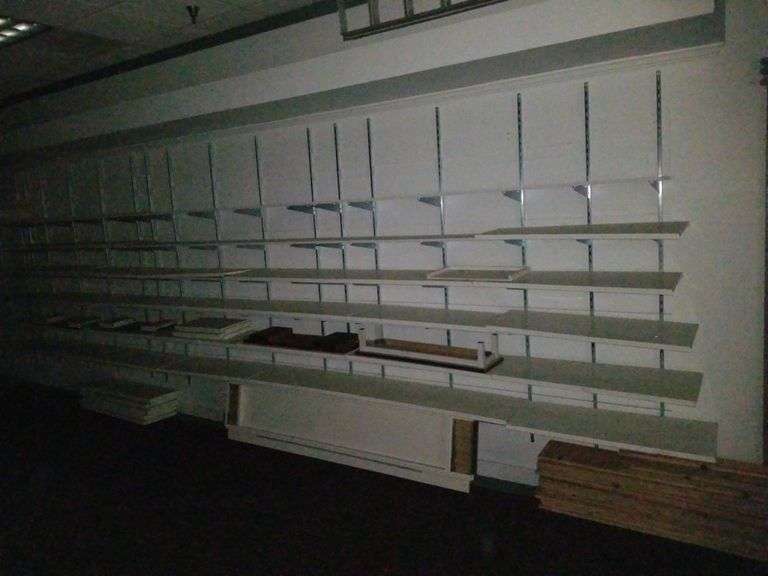 entire wall of white retail shelving, brackets, wall track to Mount