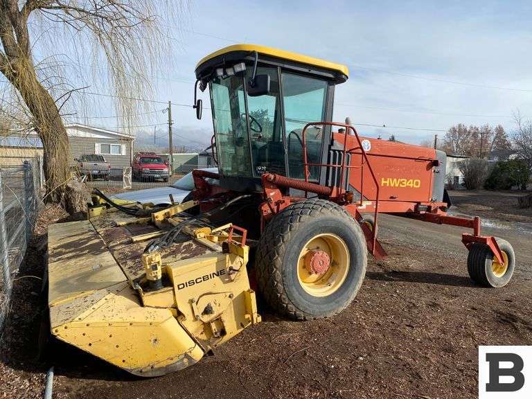 2002 New Holland HW340 Swather Booker Auction Company