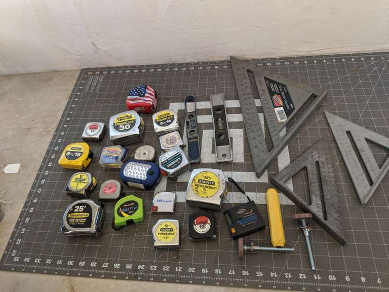 Speed squares, small levels, tape measures Bid On Estates Auction