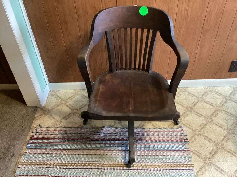 ANTIQUE WOODEN OFFICE CHAIR ON WHEELS Currie Auction Service