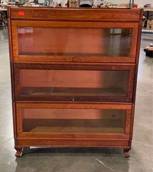 Barrister book case, in five parts. Top bottom and three glass front