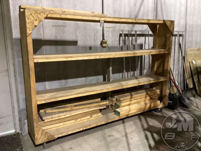 WOODEN SHELVING UNIT ON WHEELS Fahey Sales Auctioneers & Appraisers