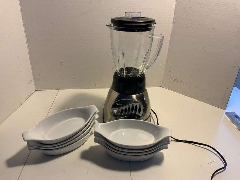 Individual serving dishes and Oster blender Legacy Auction Company