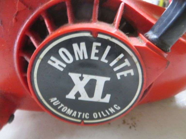 Homelite XL Chainsaw - Lambrecht Auction, Inc.