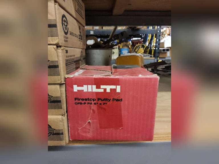 Group on half of 4th shelf Hilti firestop putty pad, 3M fire barrier