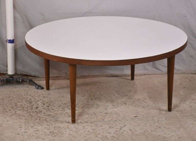 Round midcentury modern style coffee table with white formica top; 558