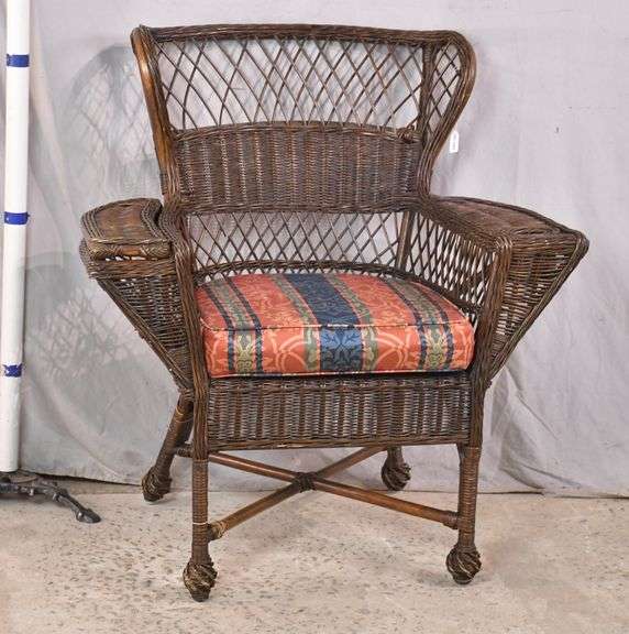 Brown wicker armchair with x stretcher base; 1111021 R.H. Lee & Co. Auctioneers