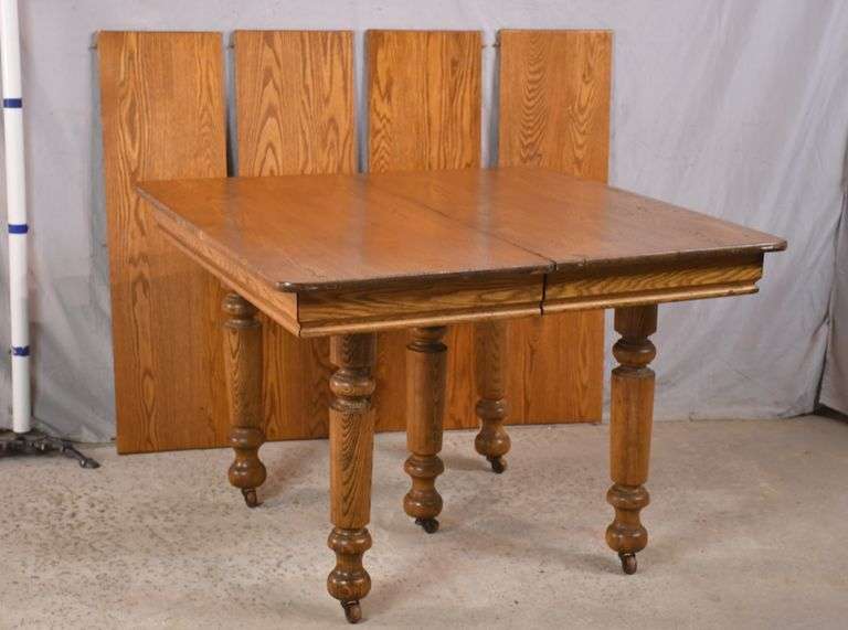 Square oak dining table with 4 leaves; 1112003 R.H. Lee & Co. Auctioneers