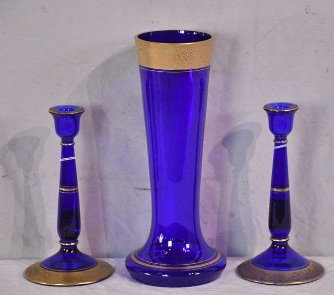 Pair of gold rimmed cobalt blue candle stands and matching vase; 1130