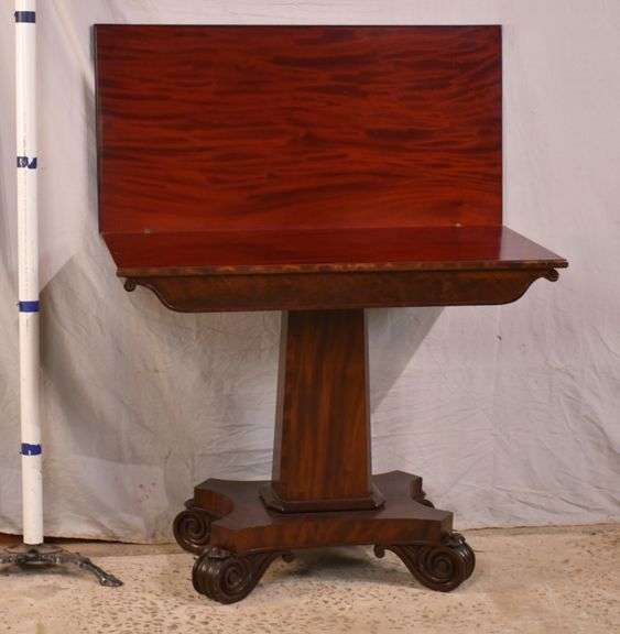 Mahogany flip top game table with single pedestal base; 682554 R.H